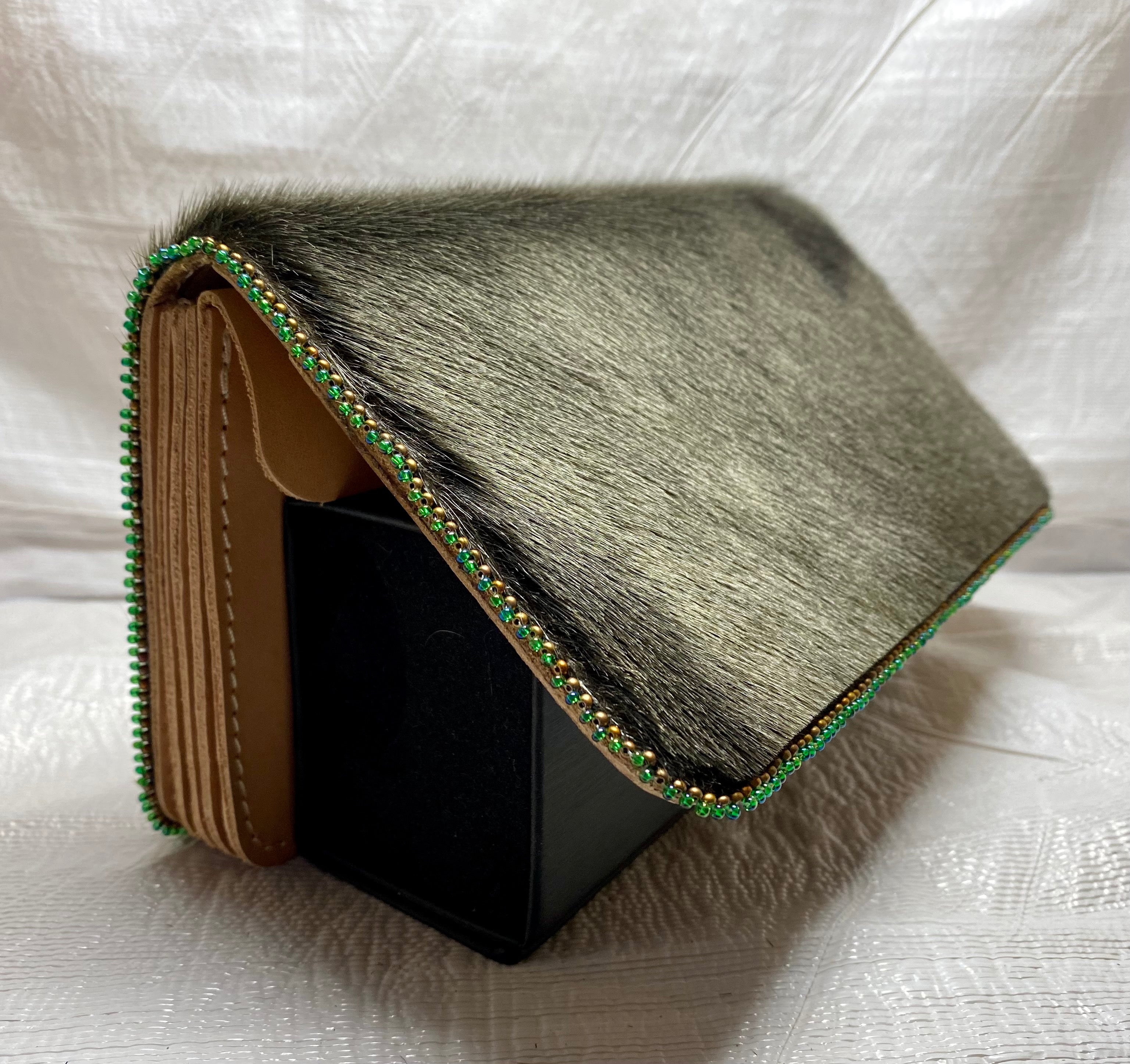 Every so often, we will see a wallet or something that would make a great transformation from nice to AWESOME ... with a little bit of seal fur and edge beading, of course.